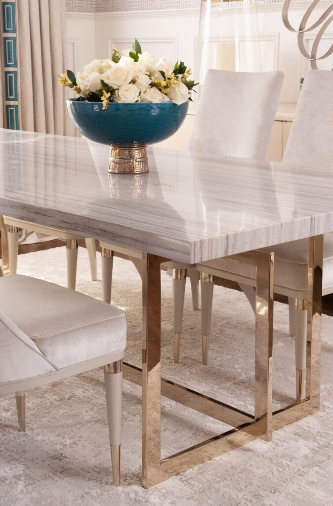 This Mesa, AZ interior decorator can create a luxurious dining room using a marble table with gold legs.