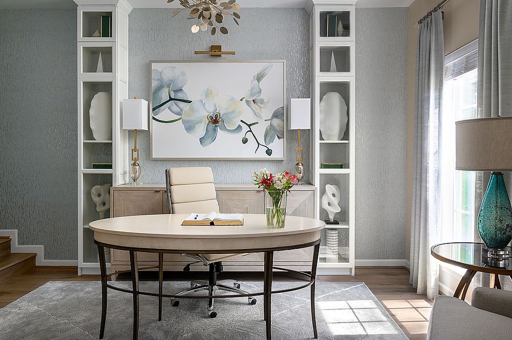 Luxury home office with custom built-in shelving and elegant lighting. 