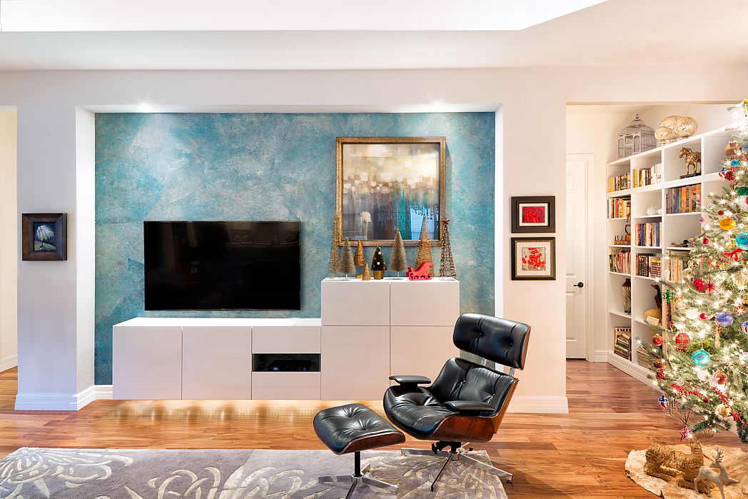 A contemporary living room with simple Christmas decorations.